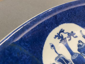 A Chinese blue, white and copper-red powder-blue-ground dish, Kangxi